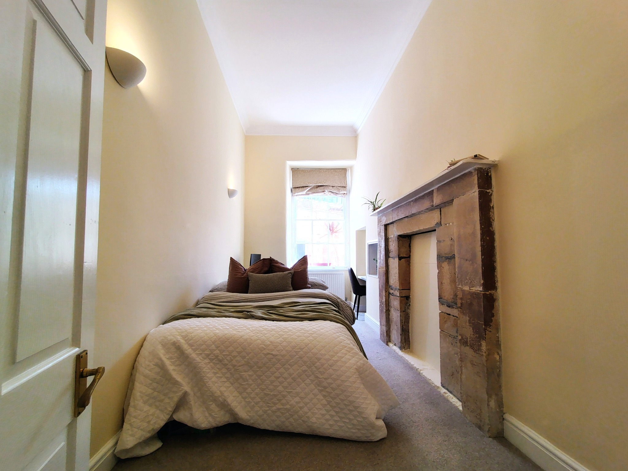 Second bedroom with original fireplace